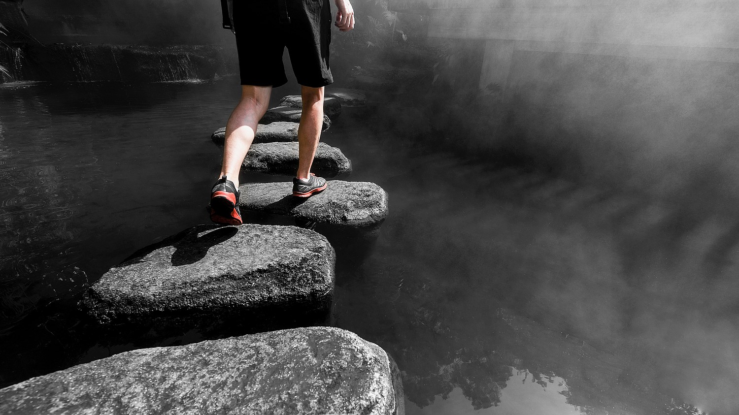 Man,Walking,Crossing,River,On,Stones,Bridge